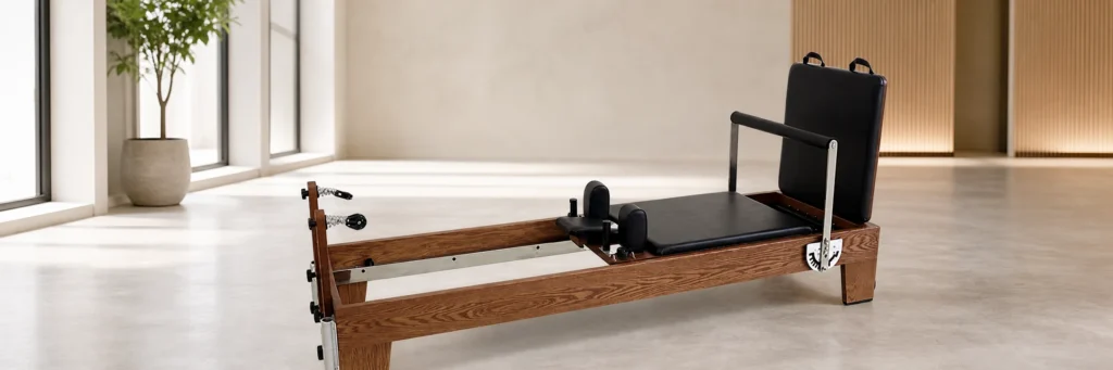 Wooden vs Aluminum Pilates Reformers: Which Is Better for Your Studio?