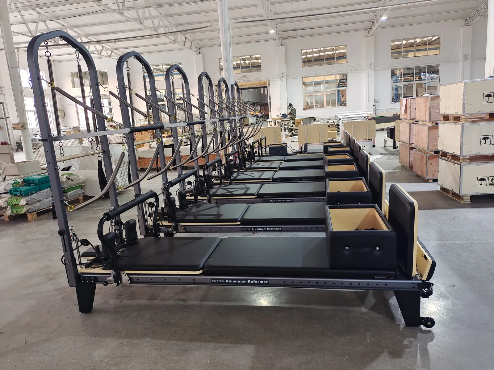 Multiple Pilates machines prepared together in the production area.
