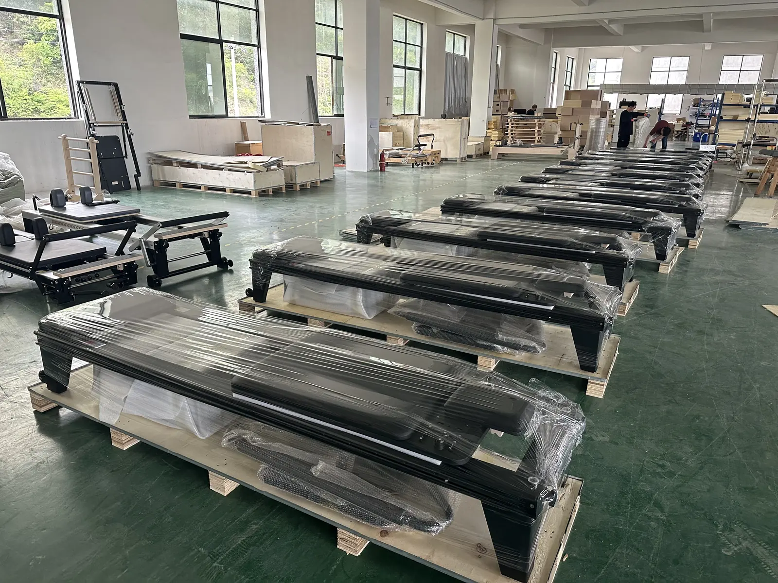 Pilates equipment protected with wrapping during order preparation.