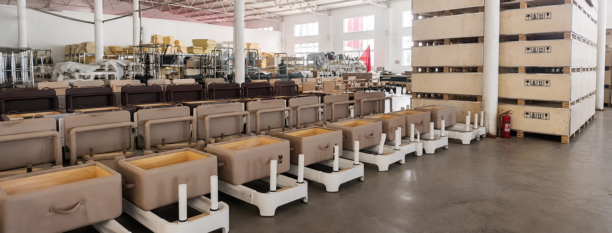 Full set of Pilates equipment arranged in a professional training facility